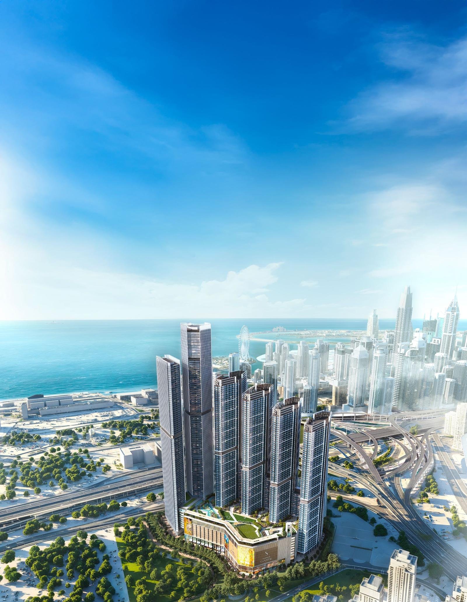 Aerial view of Sobha Central's six towers on Sheikh Zayed Road, Dubai, with the Arabian Sea and Dubai Marina in the background